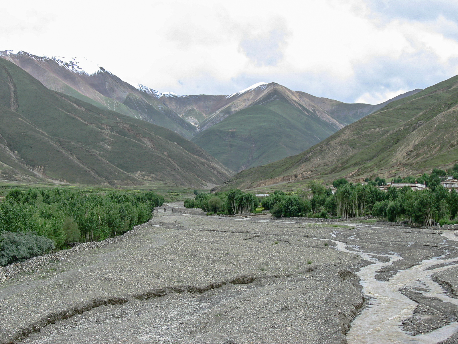 Kathmandu to Lhasa overland - Day 3 - Tingri to Xigatse - Snow peaked mountains with the wide tree lined valley below