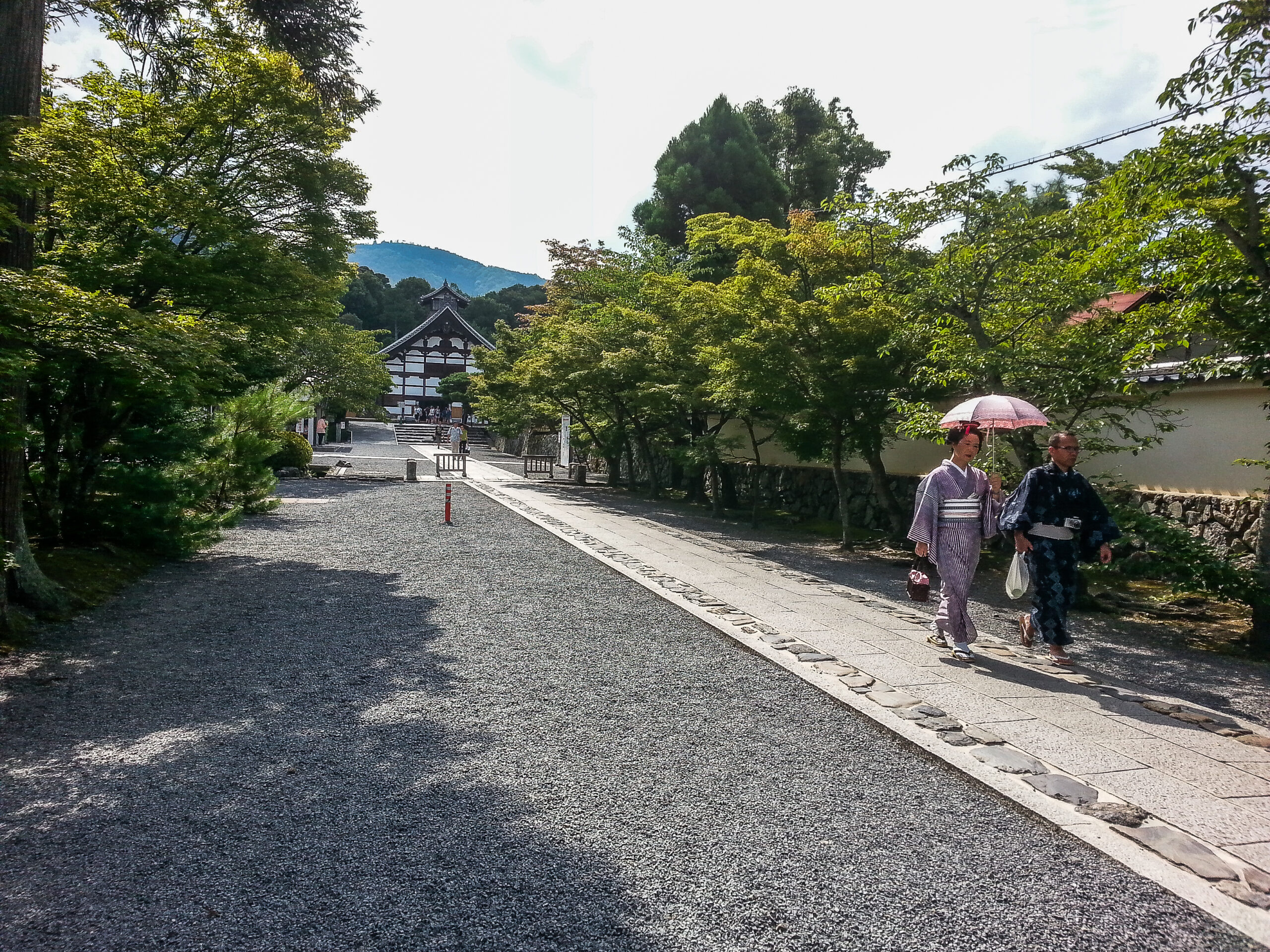 Kyoto - going for a stroll in traditional dress with Tenryu-ji in the background