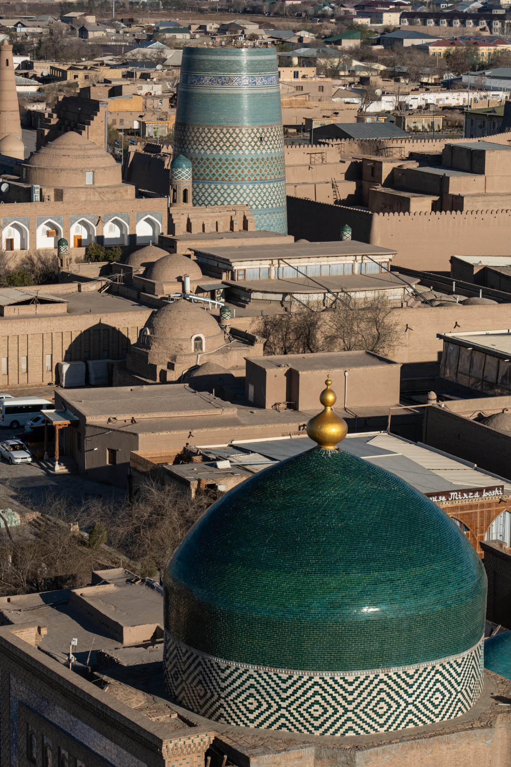 Khiva - Itchen Qala - Looking from above at the Kalta Minor Minaret and the dome of the Pahlavon Mahmud Mausoleum.