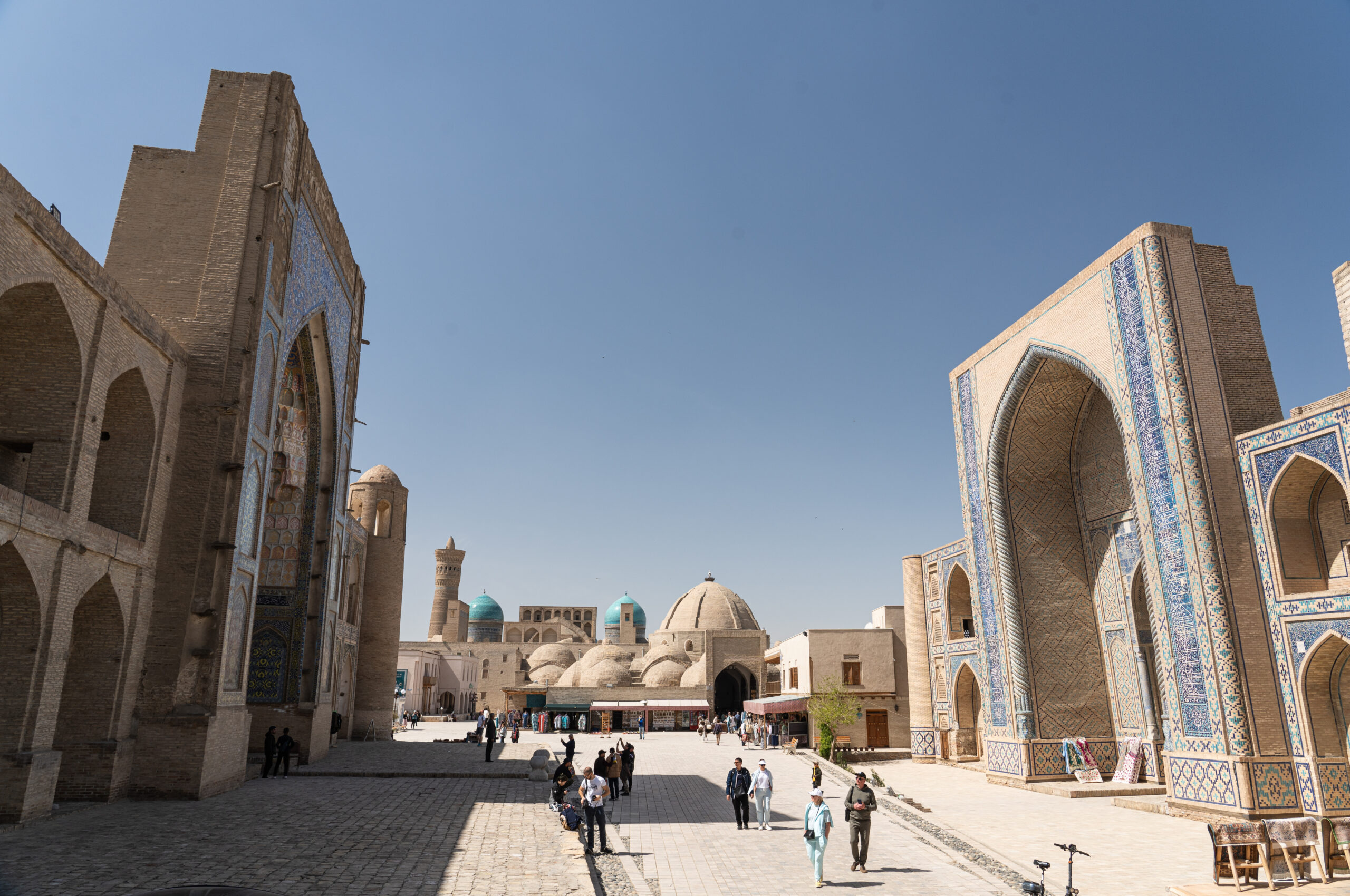 Uzbekistan - Bukhara - The Abdul Aziz Madrasah facing the Ulugbek Madrasah with the Kalon Complex in the distance